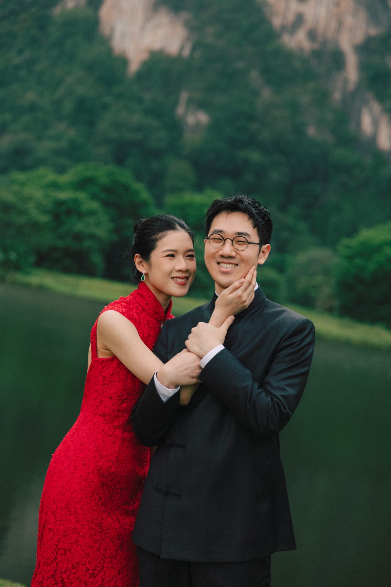 Wui Yan and Li Yen in traditional Chinese attire by a lake